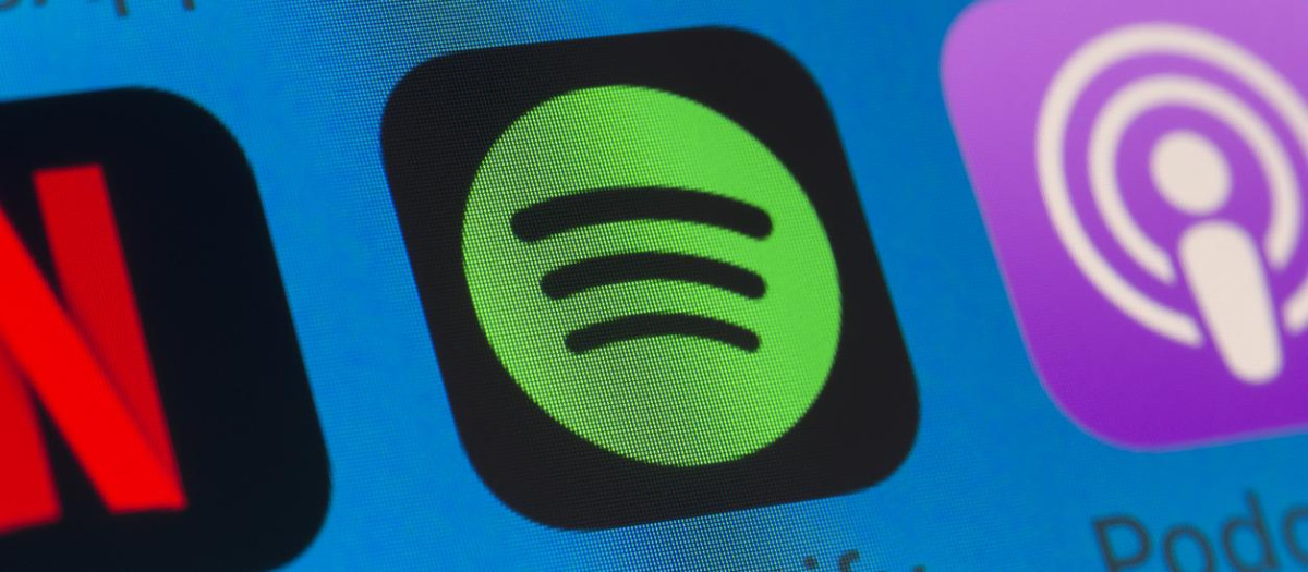 London, UK - August 01, 2018: The buttons of Spotify, Podcasts, Netflix, WhatsApp and Music on the screen of an iPhone.