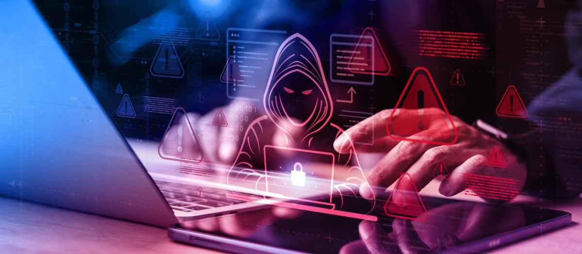 Cybersecurity threat concept with hacker icon, red alerts, and data lock over laptop, representing malware, phishing, and breach risks.