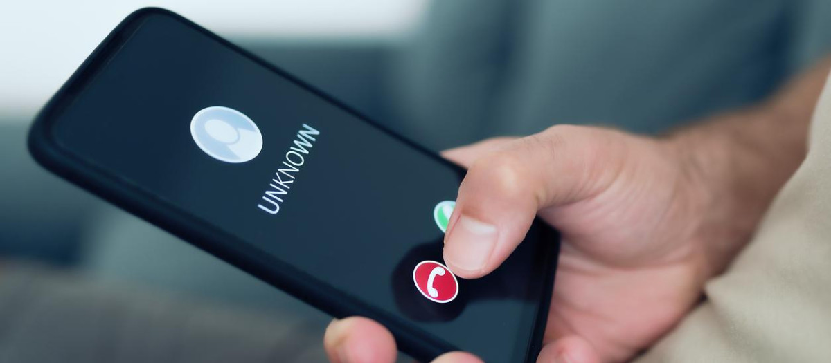 close-up view of person rejecting call from unknown caller or unknown number on smartphone, phone scam and phishing concept