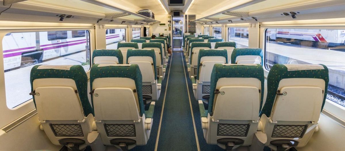 Alicante, Spain - August 20, 2011: Interior of Renfe Alta Velocidad EspaAola (AVE) high speed trains at the station platform in Alicante, Spain. These trains run on various long distance routes through the country at speeds of upto 300km/h