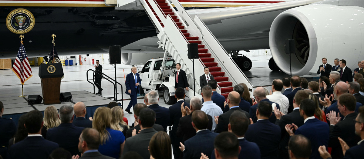 US President Donald Trump speaks in front of the new Air Force One, gifted to him by by Qatar, in a hangar at Joint Base Andrews in Maryland on June 19, 2026. White House officials bade farewell on June 18, 2026 to one of the two jets that have been used to transport US presidents for more than 30 years. The goodbye messages fueled speculation that a Boeing 747 controversially gifted to President Donald Trump by the Gulf emirate of Qatar is now due to enter service. Trump will be heading to Joint Base Andrews before spending the weekend at Camp David. (Photo by Brendan SMIALOWSKI / AFP)