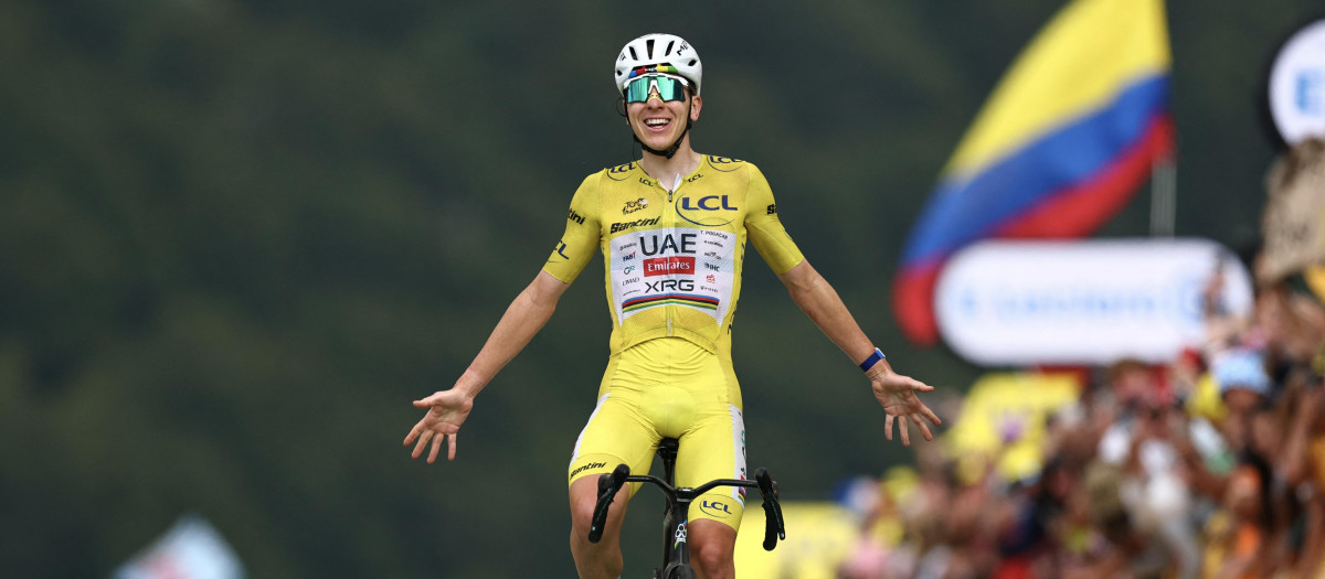 UAE Team Emirates - XRG's Slovenian rider Tadej Pogacar wearing the overall leader's yellow jersey cycles to the finish line to win the 14th stage of the 113th edition of the Tour de France cycling race, 155,3 km between Mulhouse and Le Markstein in the Vosges mountains, on July 18, 2026. (Photo by Anne-Christine POUJOULAT / AFP)
