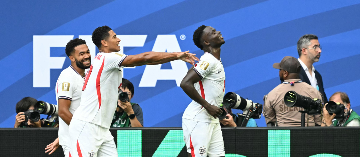 England's forward #07 Bukayo Saka celebrates scoring his team's fifth goal from the penalty spot during the 2026 World Cup football tournament third-place match between France and England at the Miami Stadium in Miami on July 18, 2026.  (Photo by CHANDAN KHANNA / AFP)