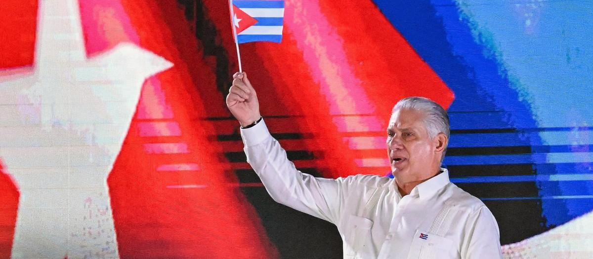 Cuba's President Miguel Díaz-Canel waves a paper flag while delivering a speech during the 73rd anniversary celebration of the guerrilla assault on the Moncada Barracks, led by the late leader Fidel Castro and considered the start of the Cuban Revolution, in Pinar del Rio, Cuba, on July 26, 2026. (Photo by YAMIL LAGE / AFP)