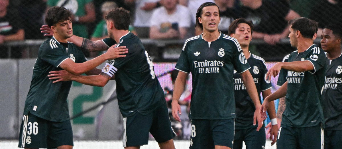 Real Madrid's Spanish defender #36 Mario Rivas (L) celebrates scoring with his team-mates during the pre-season football match between Ferencvaros and Real Madrid in Budapest, Hungary on August 8, 2026. Real Madrid on August 6, 2026 announced a new six-year deal for star forward Vinicius Junior and the signing of teenage sensation Yan Diomande in a major boost to their quest to end a two-year trophy drought. (Photo by Attila KISBENEDEK / AFP)