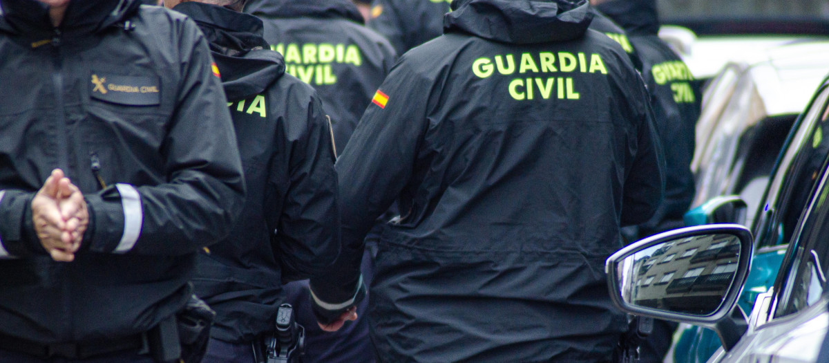 A Group of Guardia Civil Police Officers from Behind. Concept: Unity and teamwork.