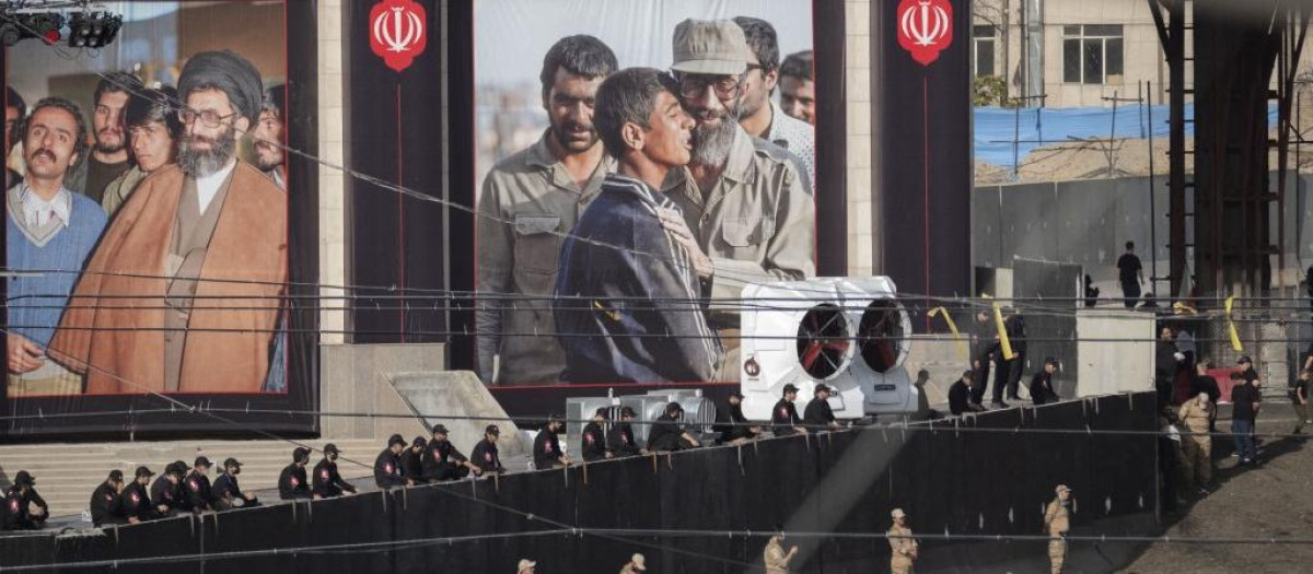 Islamic Revolutionary Guard Corps (IRGC) personnel monitor the area as mourners participate in a farewell ceremony for the bodies of Iran's Supreme Leader Ayatollah Ali Khamenei and his family at the Imam Khomeini Grand Mosque on the eve of his funeral in Tehran, Iran, on July 4, 2026. (Photo by Morteza Nikoubazl/NurPhoto) (Photo by Morteza Nikoubazl / NurPhoto via AFP)