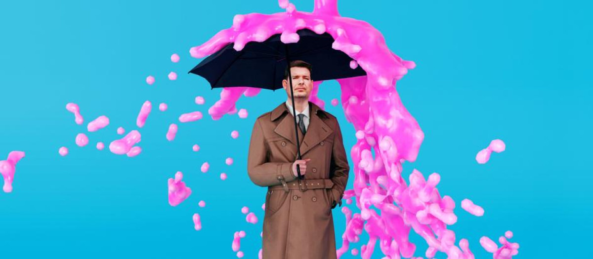 Surreal image of a man holding an umbrella, while a stream of pink paint drops from the sky. The paint hits the umbrella and falls to the side.