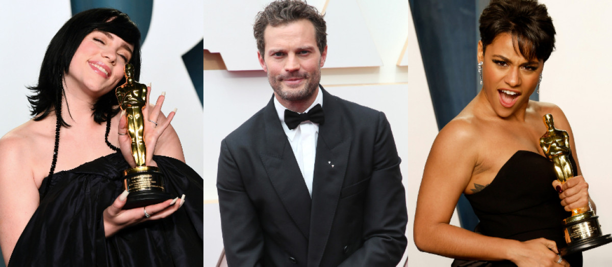 Billie Wilish y Ariana deBose posan con su premio Oscar y, en el medio, el actor Jamie Dornan nominado en la edición 2022