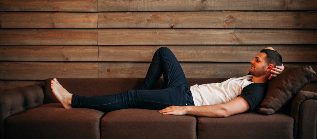 Young happy man lying on couch, side view. Relaxation on sofa. Male person relax.on,sofa,Young,happy,man,lying,couch,sofa, couch, man, lying, casual, male, home, caucasian, lifestyle, indoor, people, white, resting, young, leisure, handsome, relaxation, relax, room, happy, person, portrait, attractive, living, smile, rest, one, view, house, interior, one person, happiness, guy, side, background, cheerful, comfortable, looking, length, break, relaxing, single, domestic, life, technology, enjoyment