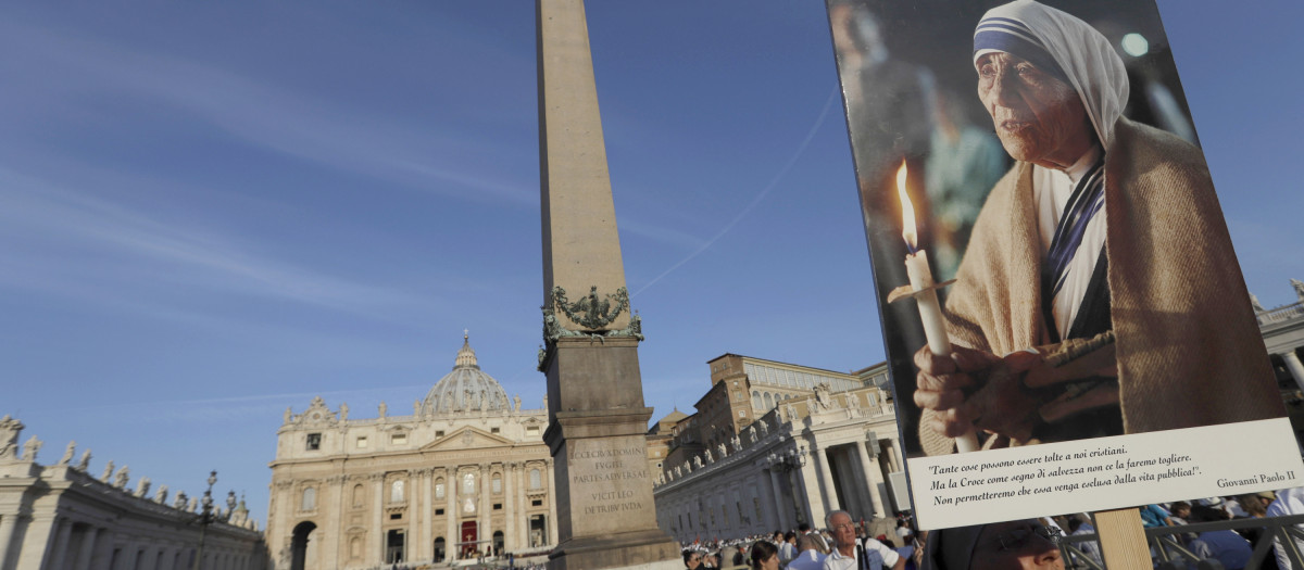 A nun holds a photo of Mother Teresa before the start of the canonization ceremony in St. Peter's Square at the Vatican, Sunday, Sept. 4, 2016. Thousands of pilgrims thronged to St. Peter's Square on Sunday for the canonization of Mother Teresa, the tiny nun who cared for the world's most unwanted and became the icon of a Catholic Church that goes to the peripheries to tend to lost, wounded souls.