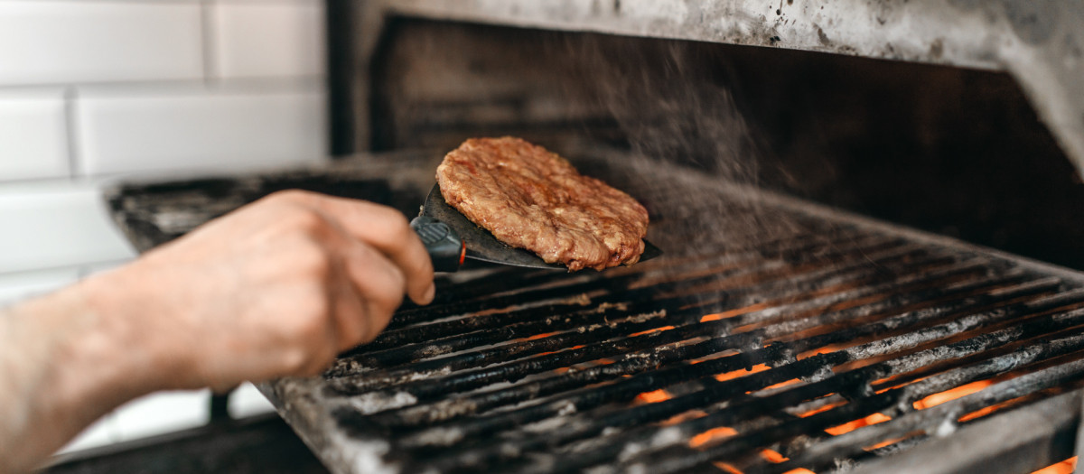 Cook hands prepares smoky meat on grill oven, burger cooking. Hamburger preparation process, fast food, bbq.Cook,hands,prepares,smoky,meat,on,grill,oven,cooking,cooking, food, burger, hamburger, meat, cook, barbecue, bbq, beef, hot, grill, meal, grilling, preparing, smoke, burgers, fast, grilled, outdoor, picnic, sandwich, chef, fire, pork, background, cheese, fresh, gourmet, heat, summer, cuisine, kitchen, restaurant, table, close, up, homemade, lettuce, lunch, people, person, patty, flame, preparation, culinary, caucasian, job, profession, recipe