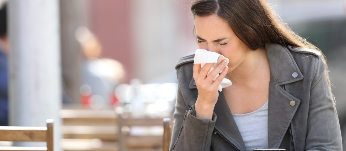 Sick woman blowing her nose with tissue sitting on a coffee shop terrace.blowing,her,nose,with,tissue,on,a,coffee,shop,allergy, sick, cough, coughing, cold, leave, flu, woman,allergy, sick, cough, coughing, cold, leave, flu, woman,allergy, sick, cough, coughing, cold, leave, flu, woman, sneezing, sneeze, summer, blow, blowing, tissue, coffee, shop, outdoor, sunny, sun, outside, cafe, bar, restaurant, terrace, season, grippe, ill, snot, allergies, spreading, allergic, person, mucus, infection, nose, girl, hand, spring, suffering, teenager, influenza, pain, disease, people, health, care, healthcare, coronavirus, contagion, infected, symptoms, contagious, sickness, illness, covering, lady, bad, virus, air, city, street, contamination, pollution, environment, young, adult, public, urban, teen, female