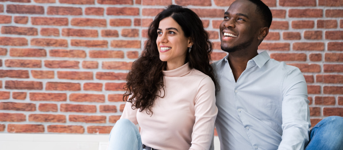 Portrait Of Young Multiethnic Couple Sitting On Floor In Their New Home.Couple,New,moving, african, couple, house, black, new, move, family,moving, african, couple, house, black, new, move, family, people, home, young, happy, apartment, 2, american, room, man, floor, woman, middle, living, key, asian, arabian, full, person, ethnic, multiracial, arabic, interior, looking, together, relationship, male, two, sitting, casual, female, love, smiling, muslim, eastern, smile, lifestyle, adult