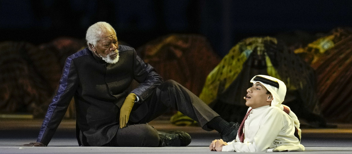 US actor Morgan Freeman, left, sits on the stage at the opening ceremony prior he World Cup, group A soccer match between Qatar and Ecuador at the Al Bayt Stadium in Al Khor, Sunday, Nov. 20, 2022. (AP Photo/Natacha Pisarenko) *** Local Caption *** .