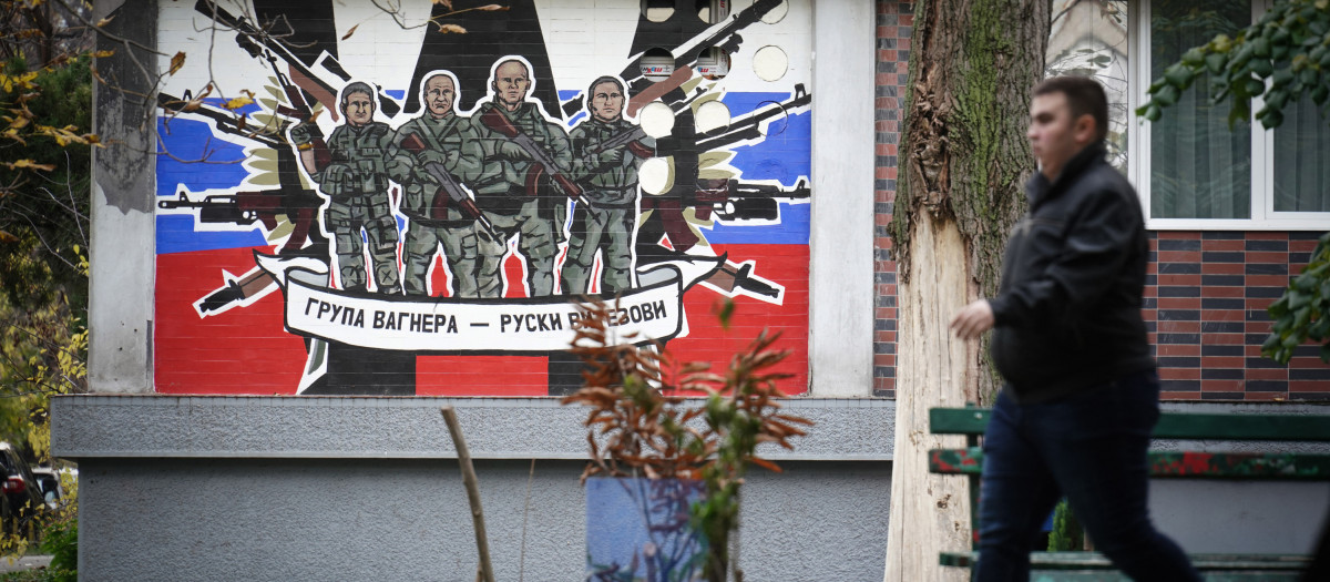 A pedestrian walks past a mural depicting Russia's para military mercenaries 'Wagner Group' reading : "Wagner Group - Russian knights" on a building's wall in Belgrade, on November 17, 2022. - A group of Russian children of all ages clamour cheerfully in a Belgrade apartment, proudly shouting out the new Serbian words they learned to their teacher.
These kids all have one thing in common. Their parents fled the country after Russian President Vladimir Putin's invasion of Ukraine and are now preparing to stay in the Balkan country for the long haul. (Photo by OLIVER BUNIC / AFP)