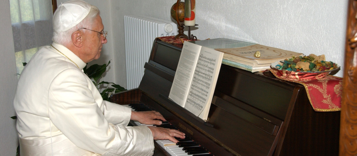 In this photo released Monday July 17, 2006 by the Vatican newspaper L'Osservatore Romano, Pope Benedict XVI plays a piano in Les Combes d'Introd, in the Aosta Valley region, northern Italy, Friday, July 14, 2006.