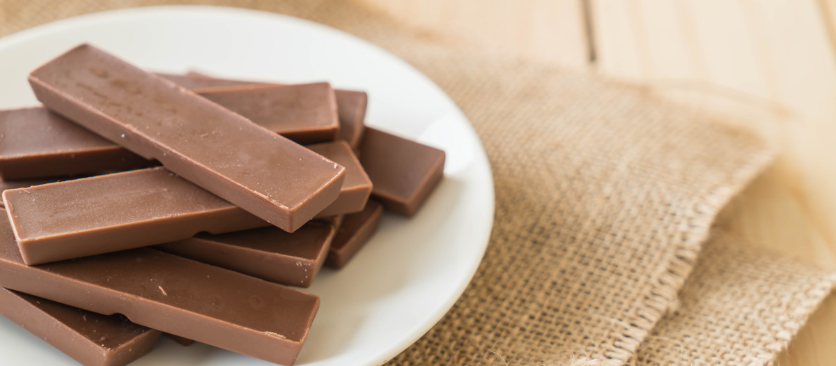 chocolate bars on wood background