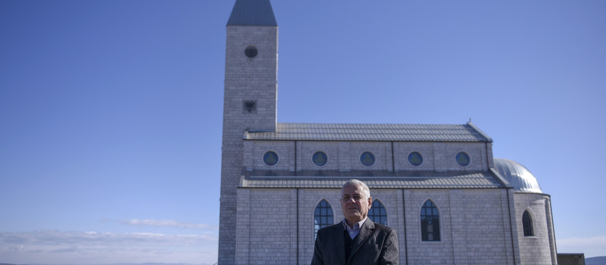 Ismet Sopi poses in front of the church of the village of Llapushnik on February 2, 2023. - In an austere church perched above a picturesque valley in central Kosovo, Ismet Sopi recounts how his family hid their Catholic faith for centuries, after converting to Islam during the Ottoman conquest of the Balkans.
For generations, his forebears maintained their religious convictions secretly, he explains, until 2008 when Sopi and his family openly embraced their Catholicism and were baptised together. (Photo by Armend NIMANI / AFP)