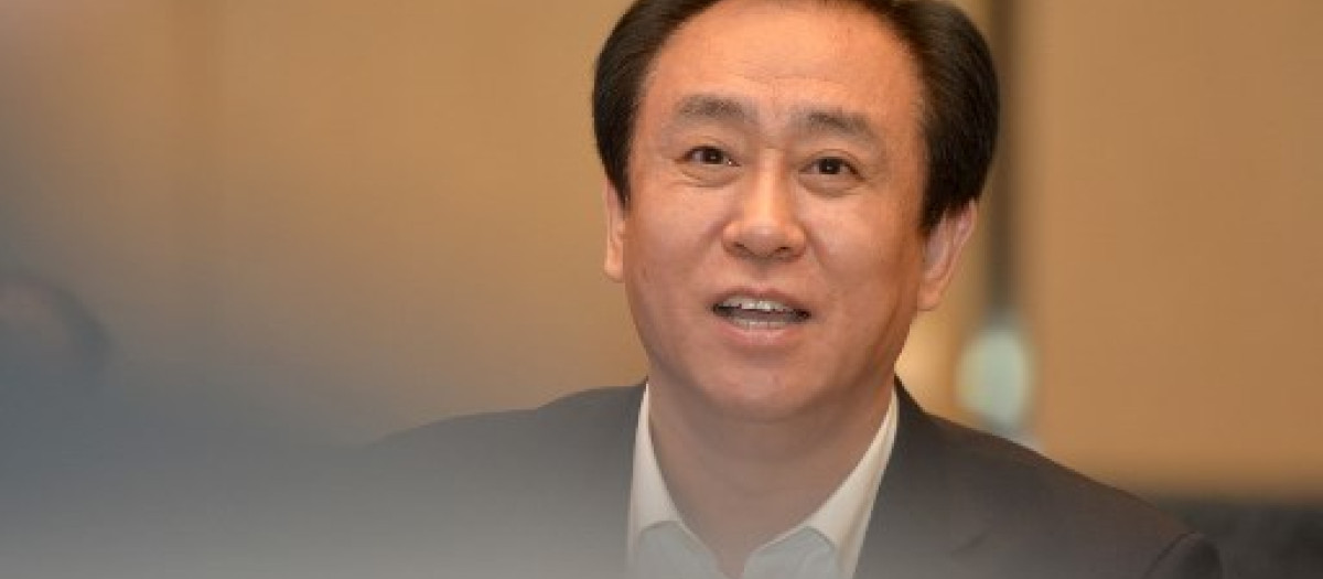 (FILES) This photo taken on June 5, 2017 shows Evergrande's president Xu Jiayin, also known as Hui Ka Yan in Cantonese, attending a meeting in Wuhan, in China's central Hubei province. Billionaire Xu, of beleaguered Chinese property developer China Evergrande, is being held by police, a report said on September 27, 2023, as the debt-ridden company grapples with severe financial difficulties. (Photo by AFP) / China OUT