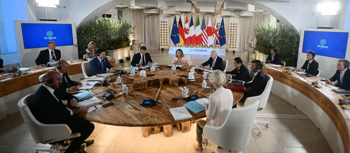 From left : President of the European Council Charles Michel, German Chancellor Olaf Scholz, Canadian Prime Minister Justin Trudeau, French President Emmanuel Macron, Italy's Prime Minister Giorgia Meloni, US President Joe Biden, Japanese Prime Minister Fumio Kishida, British Prime Minister Rishi Sunak, President of the European Commission Ursula von der Leyen,  attend a working session on Africa, Climate Change and Development at the Borgo Egnazia resort during the G7 Summit hosted by Italy in Apulia region, on June 13, 2024 in Savelletri. Leaders of the G7 wealthy nations gather in southern Italy this week against the backdrop of global and political turmoil, with boosting support for Ukraine top of the agenda. (Photo by Filippo MONTEFORTE / AFP)
