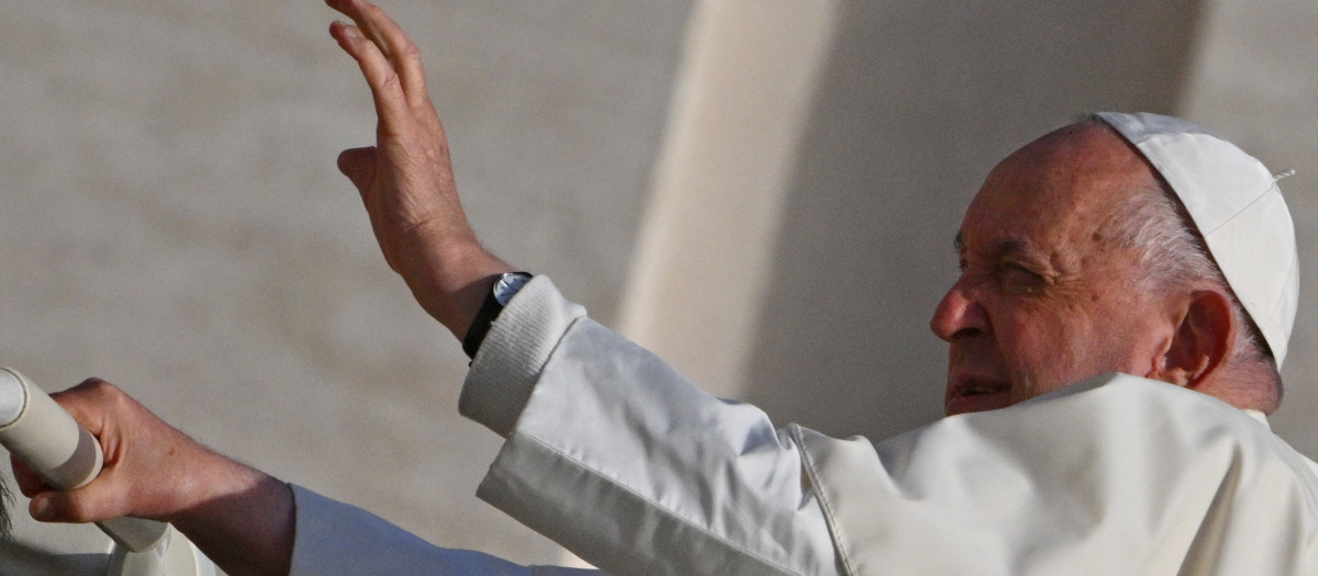 Pope Francis waves to the crowd from the popemobile as he arrives for the weekly general audience on October 9, 2024 at St Peter's square in The Vatican. (Photo by Andreas SOLARO / AFP)