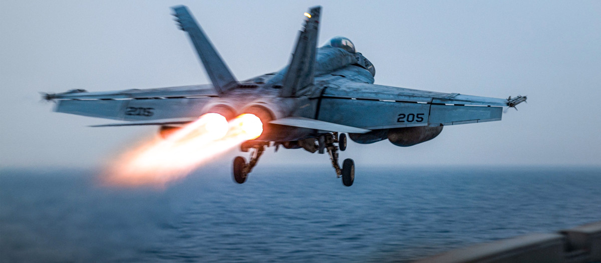 This handout photo released by the US Defence Visual Information Distribution Service (DVIDS) shows a US F/A-18 Super Hornet attack fighter jet taking off from the US Navy's Nimitz-class USS Harry S. Truman aircraft carrier at sea on March 16, 2025. Strikes hit Yemen's Huthi-held capital Sanaa on March 15, the rebels' Al-Masirah TV said, after US President Donald Trump announced military action. "An American-British aggression raided a residential neighbourhood in the Shuub district, north of the capital, Sanaa," Al-Masirah said. There was no immediate comment from British authorities. (Photo by Darren CORDOVIZ / DVIDS / AFP)