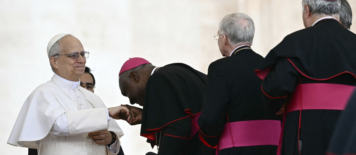 Pope Leo XIV greets bishops at the end of his first weekly general audience at St Peter's Square in The Vatican on May 21, 2025. (Photo by Filippo MONTEFORTE / AFP)