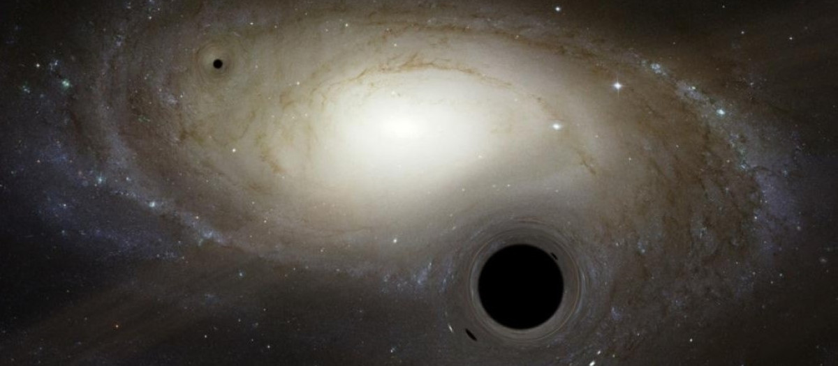 Recreación artística de varios agujeros negros de masa intermedia moviéndose en las inmediaciones de una galaxia