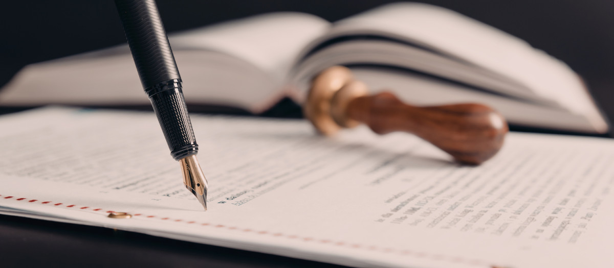 Agreement concept with fountain pen and documents. Notary public, attorney, law close up composition