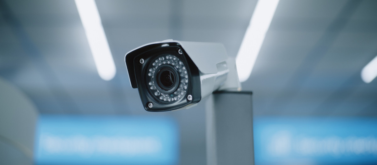 Advanced Airport Security System: Close Up of Installed CCTV Camera. Professional Video Surveillance System in Modern Airport Terminal. Monitoring, Tracking and Scanning Technology for Travel Safety.