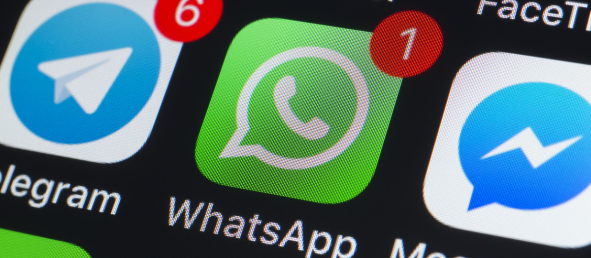 London, UK - July 19, 2018: The buttons of Whatsapp, Messenger, Telegram, Pinterest Twitter, Facetime and other chat apps on the screen of an iPhone.