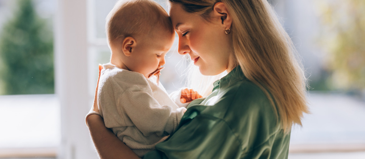 The profound connection between a loving mother and her baby, a serene snapshot of the beauty and tenderness of motherhood.
