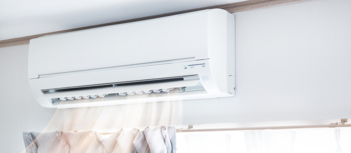 Air conditioner blowing warm air