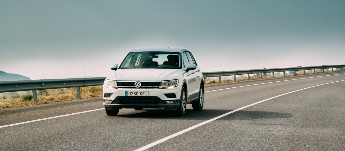 Tor, Girona, Spain - May 17, 2018: 2018 Volkswagen Tiguan SE Nav TSi 1.4 Car Of White Color In Motorway.
