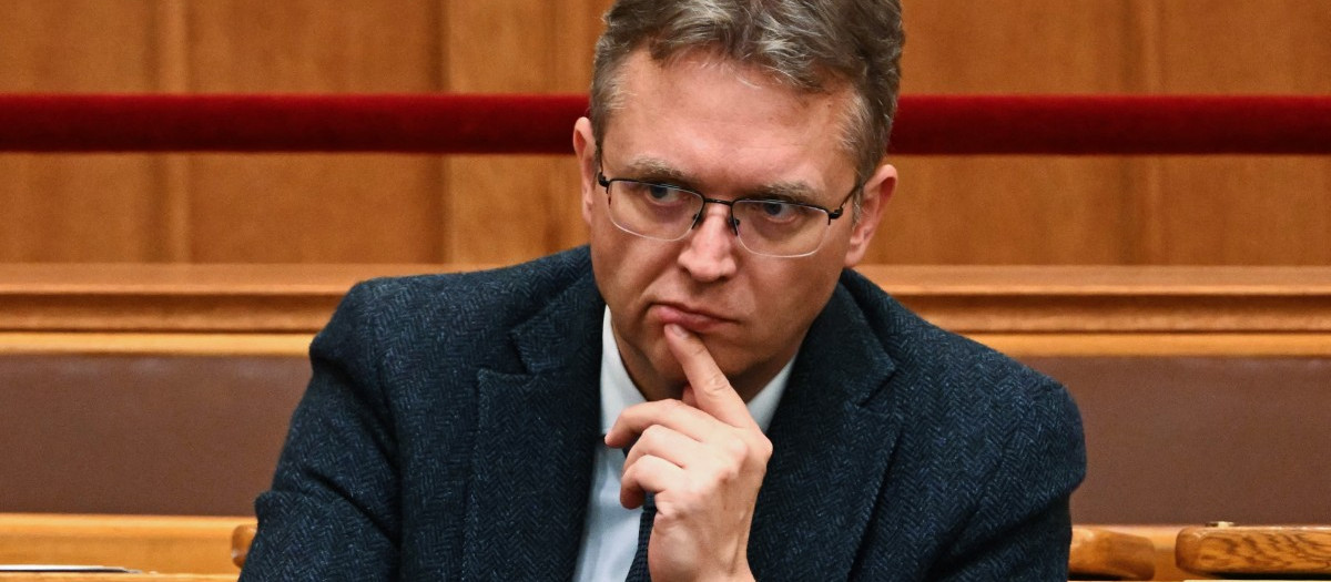 Balazs Hanko, a lawmaker of Hungary's opposition Fidesz party, listens during a parliamentary session in Budapest, Hungary, on September 22, 2026. As former minister of culture and innovation, Hanko supervised the allocation of roughly 17 billion forints (47 million Euros) in National Cultural Fund (NKA) grants before the change of government, which are now the subject of a criminal investigation. Independent media outlets allege the cultural fund served as a state-run payment centre for Fidesz' inner circle, as well as a shadow campaign fund. Hanko denies wrongdoing, but multiple former officials including his chief of staff have been arrested over the summer. (Photo by Attila KISBENEDEK / AFP)