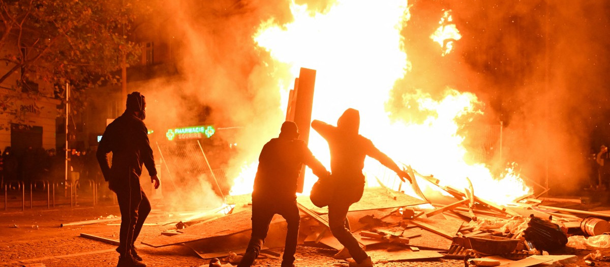 This photograph shows a fire burning and destroying the city hall after a group of individuals forced entry into the building during ongoing protest action against the "high cost of living", in Limoges, central France on October 17, 2026 as part of a nationwide call for mobilisation bringing together various groups expressing their anger: former "Yellow Vest", secondary school and university students, climate activists and even farmers. After weeks of student protests, France faces broader, nationwide demonstrations on October 17, 2026 over the cost of living, setting up a potentially fraught six months heading into a presidential election. A police source told AFP that authorities estimated nearly 200,000 people could take part, with 40,000 in Paris. (Photo by Melaine PAYZAL / AFP)