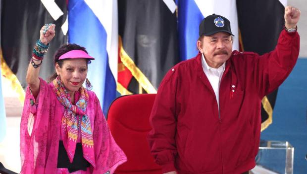 This handout picture released by the Nicaraguan Presidency shows Nicaragua's President Daniel Ortega (R) and his wife and Vice-President Rosario Murillo (L) greeting supporters during an act to commemorate the 44th anniversary of the Nicaraguan Revolution in Managua, on July 19, 2023. (Photo by Jairo CAJINA / Nicaraguan Presidency / AFP) / RESTRICTED TO EDITORIAL USE - MANDATORY CREDIT "AFP PHOTO / NICARAGUAN PRESIDENCY / JAIRO CAJINA" - NO MARKETING NO ADVERTISING CAMPAIGNS - DISTRIBUTED AS A SERVICE TO CLIENTS