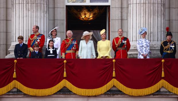 Britain's King Charles III (C-L) and Britain's Queen Camilla (C-R) stand with (L-R) Britain's Prince George of Wales, Britain's Prince William, Prince of Wales, Britain's Prince Louis of Wales, Britain's Catherine, Princess of Wales, Britain's Princess Charlotte of Wales, Britain's Sophie, Duchess of Edinburgh, Britain's Prince Edward, Duke of Edinburgh, Britain's Lady Louise Windsor and Britain's Princess Anne, Princess Royal, on the balcony of Buckingham Palace after attending the King's Birthday Parade "Trooping the Colour" in London on June 15, 2024. The ceremony of Trooping the Colour is believed to have first been performed during the reign of King Charles II. Since 1748, the Trooping of the Colour has marked the official birthday of the British Sovereign. Over 1500 parading soldiers and almost 300 horses take part in the event. (Photo by HENRY NICHOLLS / AFP)