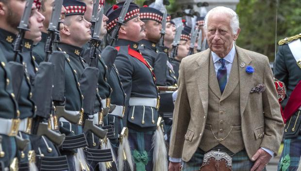 King Charles III meets members of the Band of The Royal Regiment of Scotland and the Pipes and Drums of the Royal Corps of Signals after inspecting the Balaklava Company, 5th Battalion on Monday August 19, 2024.