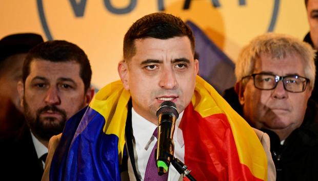 Leader of far-right Alliance for the Unity of Romanians AUR party, George Simion addresses supporters in Bucharest, Romania on December 1, 2024, after the announcement of the first exit polls of the country's parliamentary elections. Romania's ruling Social Democrats (PSD) were leading in Sunday's parliamentary elections, but the far right secured big gains, according to an exit poll published by local media. (Photo by Daniel MIHAILESCU / AFP)