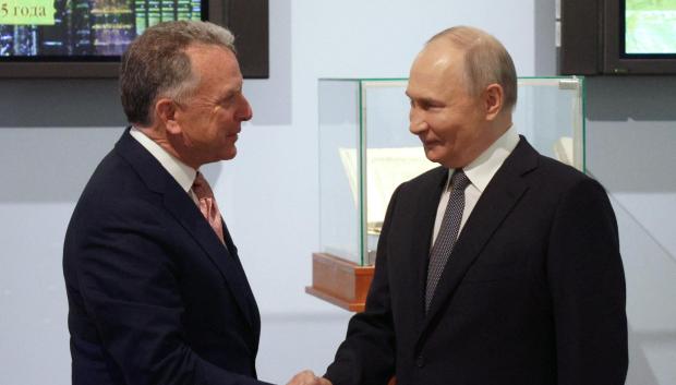 In this pool photograph distributed by the Russian state agency Sputnik, Russia's President Vladimir Putin shakes hands with US President Donald Trump's envoy Steve Witkoff during a meeting in Saint Petersburg on April 11, 2025. (Photo by Gavriil Grigorov / POOL / AFP)