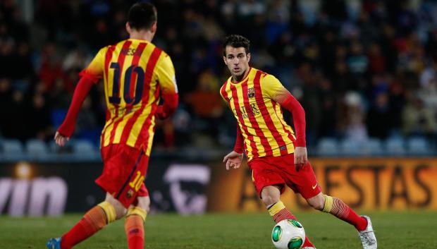 Fàbregas y Messi disputando un encuentro en el Coliseum
