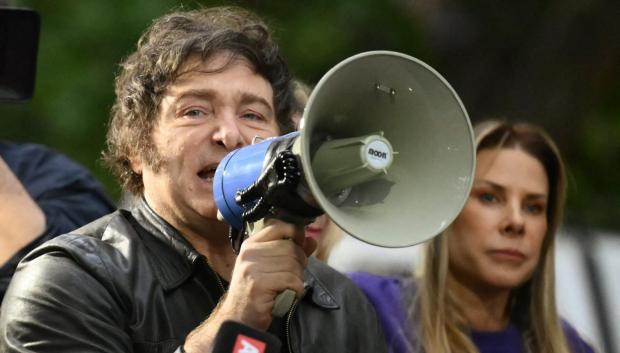 Argentina's President Javier Milei speaks to supporters during a campaign rally ahead of the upcoming legislative elections at Tres de Febrero, Buenos Aires province, on October 17, 2025. Milei, once a global poster boy for budget-slashing libertarian politics, is heading into the polls diminished by his failure to stabilize Argentina's ailing peso despite spending nearly all the Central Bank's dollar reserves to prop it up. (Photo by Luis ROBAYO / AFP)