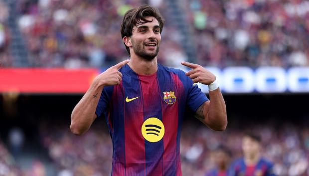 Barcelona's Spanish forward #07 Ferran Torres celebrates scoring his team's second goal during the Spanish league football match between FC Barcelona and RCD Espanyol at the Camp Nou stadium in Barcelona on April 11 , 2026. (Photo by Josep LAGO / AFP)
