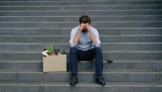 Stressed Caucasian middle aged business man lost job fired work sitting stairs near office building with dismissal box businessman male suffering sad thinking trouble crisis financial failure dismiss. High quality 4k footage