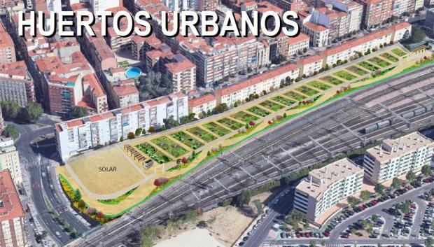 Huertos urbanos y carril bici junto a la vía del tren en el barrio de Garrido