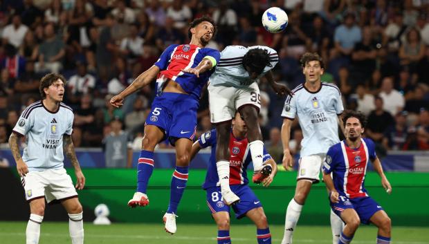 Paris Saint-Germain's Brazilian defender #05 Marquinhos and Aston Villa's English striker #39 Brian Madjo vie for the ball during the UEFA Supercup football match between Champions League winners Paris Saint Germain (PSG) and Europa League winners Aston Villa in Salzburg, Austria on August 12, 2026. (Photo by FRANCK FIFE / AFP)