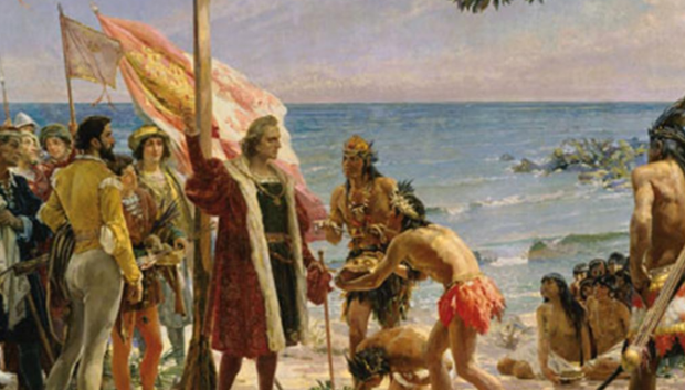 Cristóbal Colón, junto a unos indígenas.