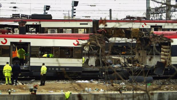 MADRID, SPAIN - MARCH 12:  One of the bomb damaged trains is towed past another at Atocha train station on March 12, 2004 in Madrid, Spain. According to judicial sources 198 people were killed in the series of three blasts.   (Photo by Bruno Vincent/Getty Images)